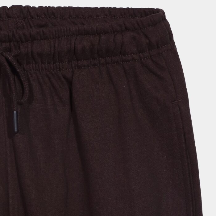 Close-up of drawstring and elastic waistband on luxury joggers.